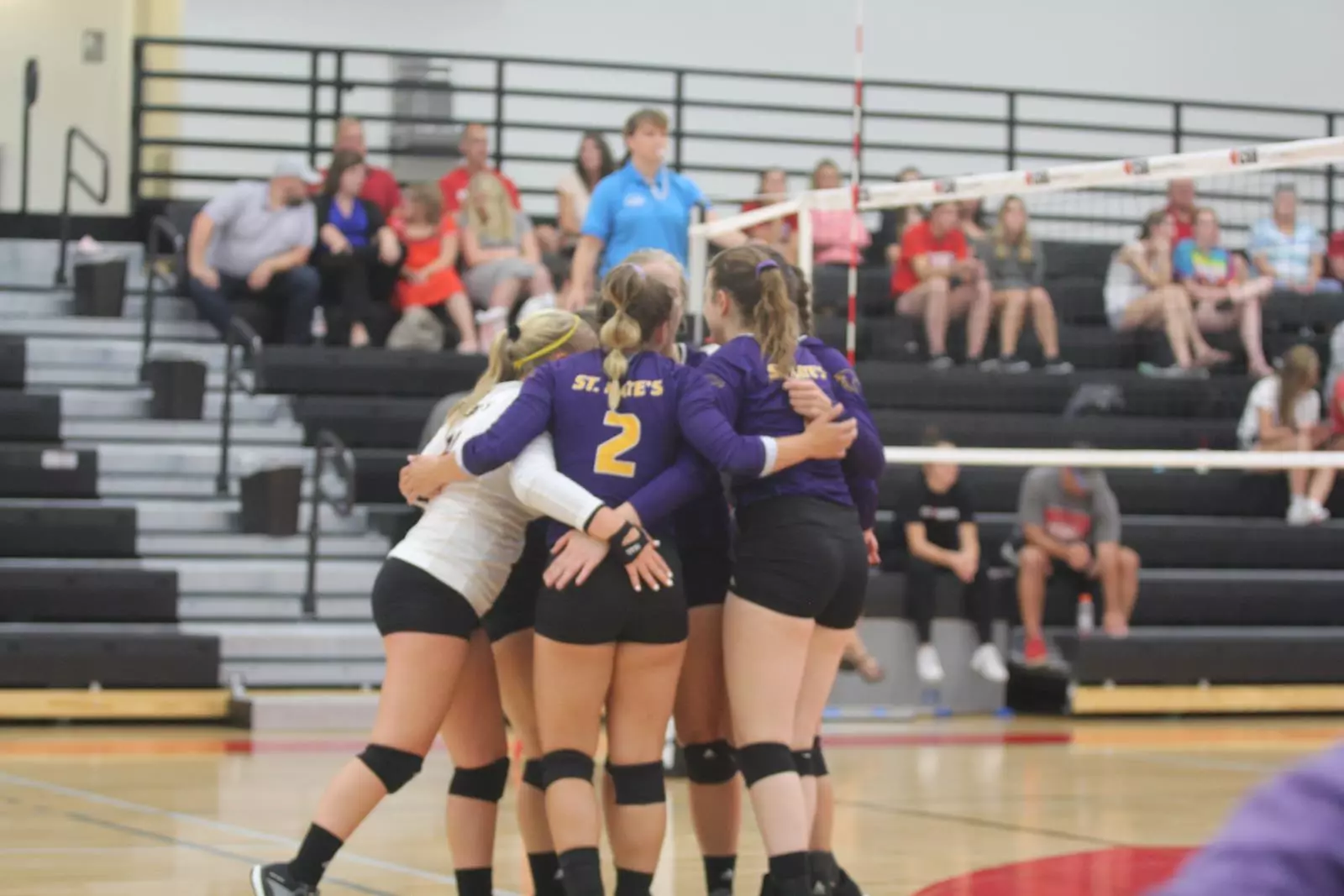 team huddle volleyball at CSB