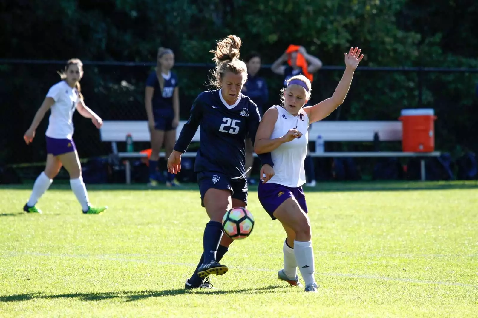 Alyssa Siljendahl and Carleton Player Battling for Ball