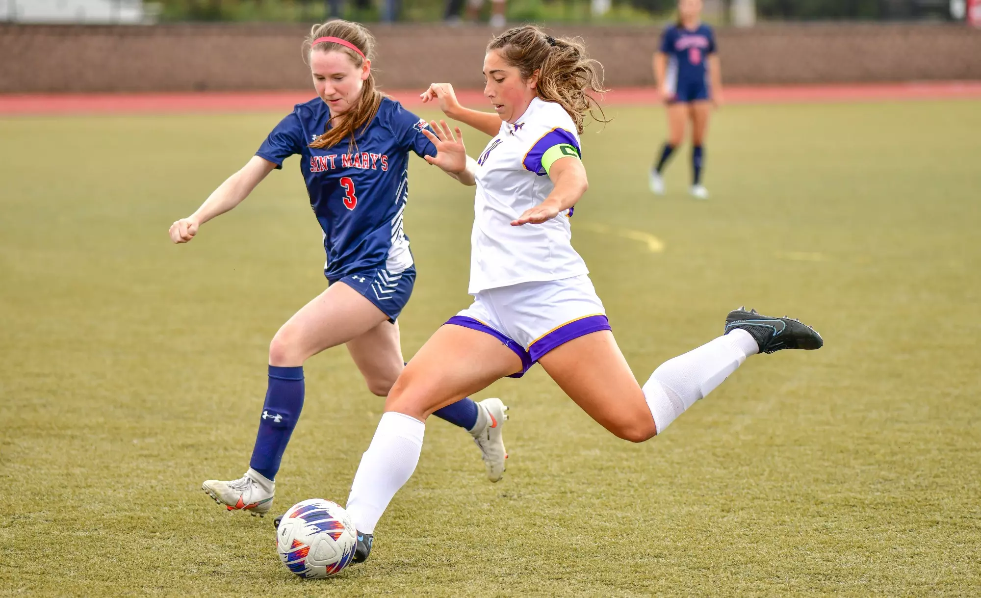 Lauren Witte kicking soccer ball