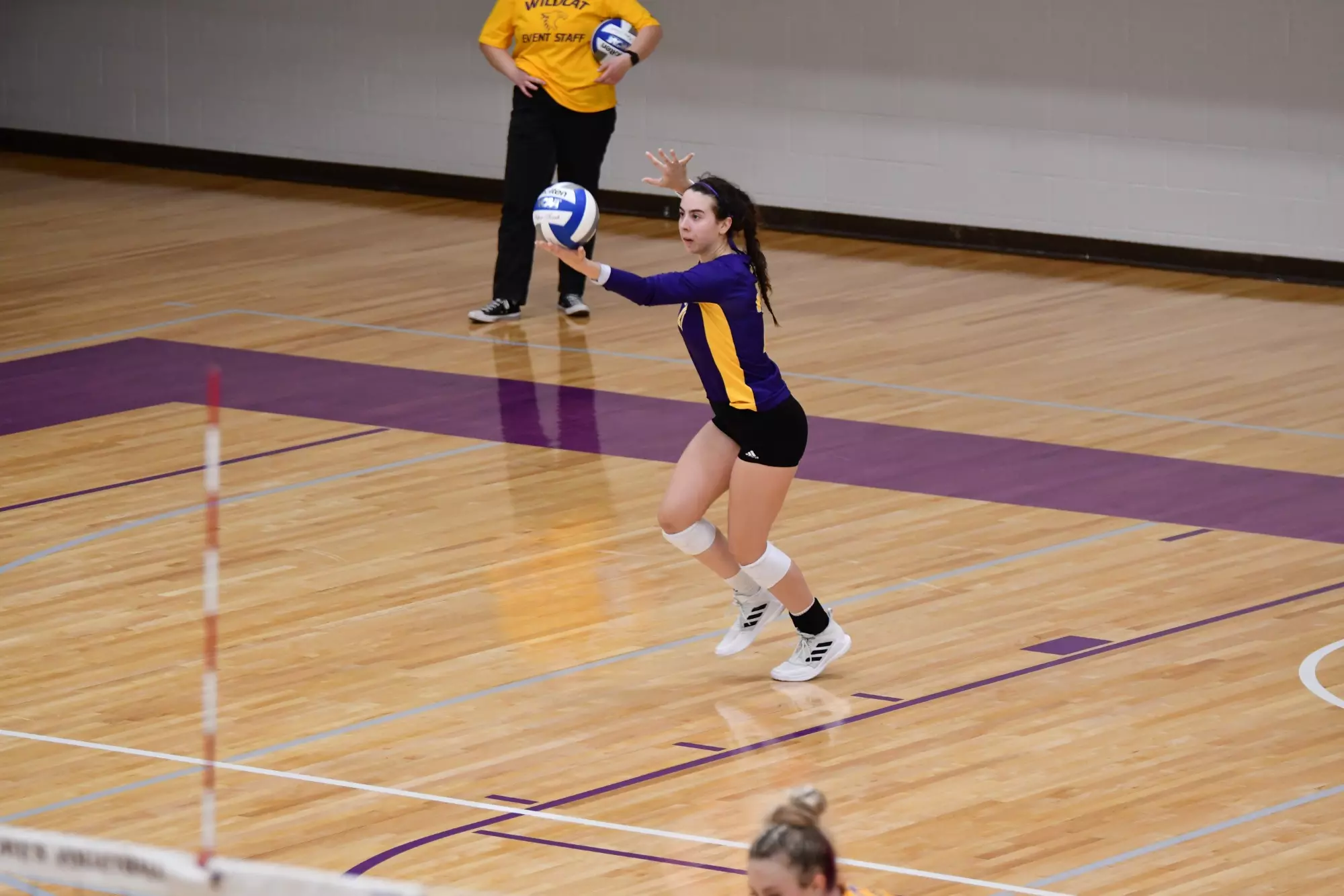 Lexie Petrick serving