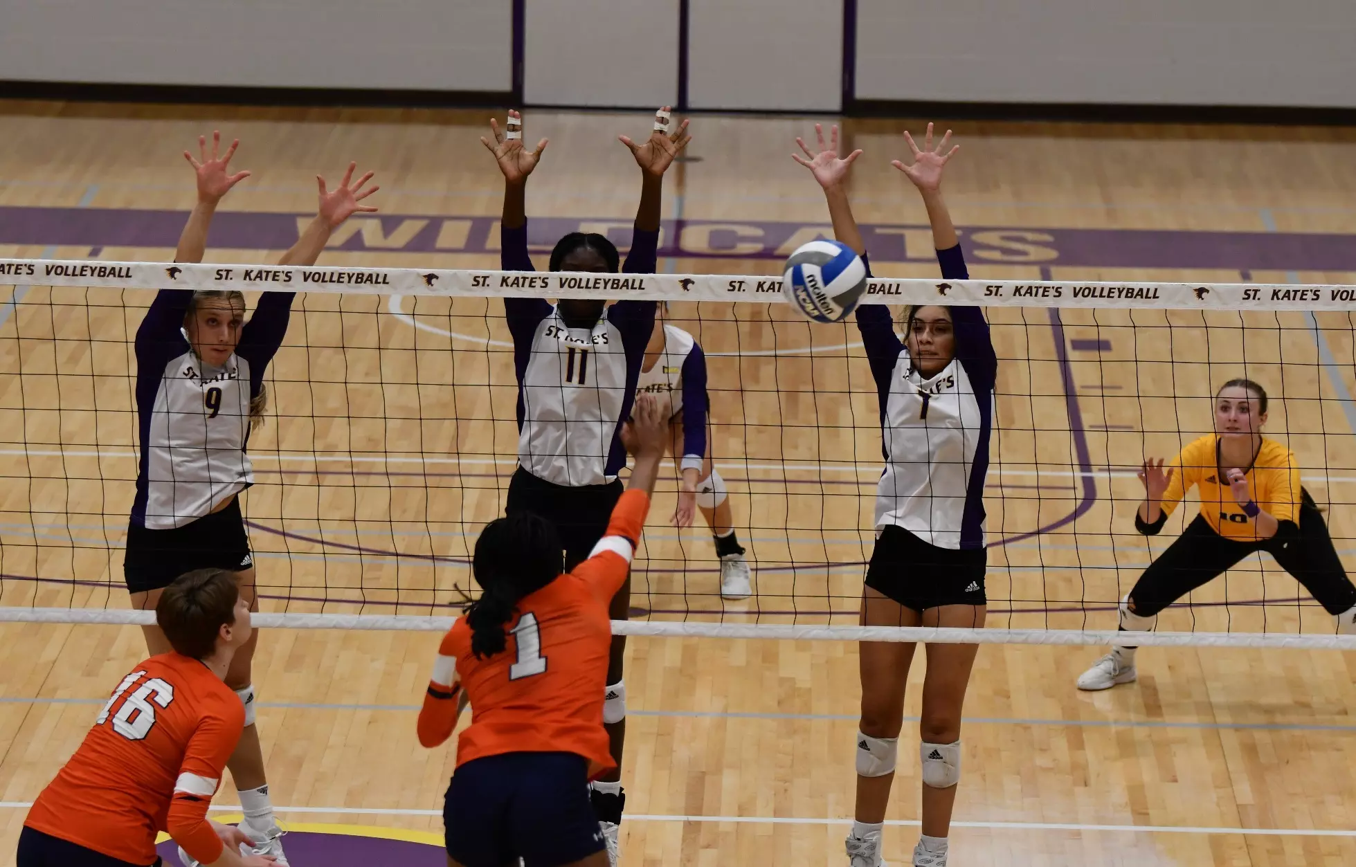 Maggie Rosen, Madison Fagan, Tiffany Tellez at the net blocking