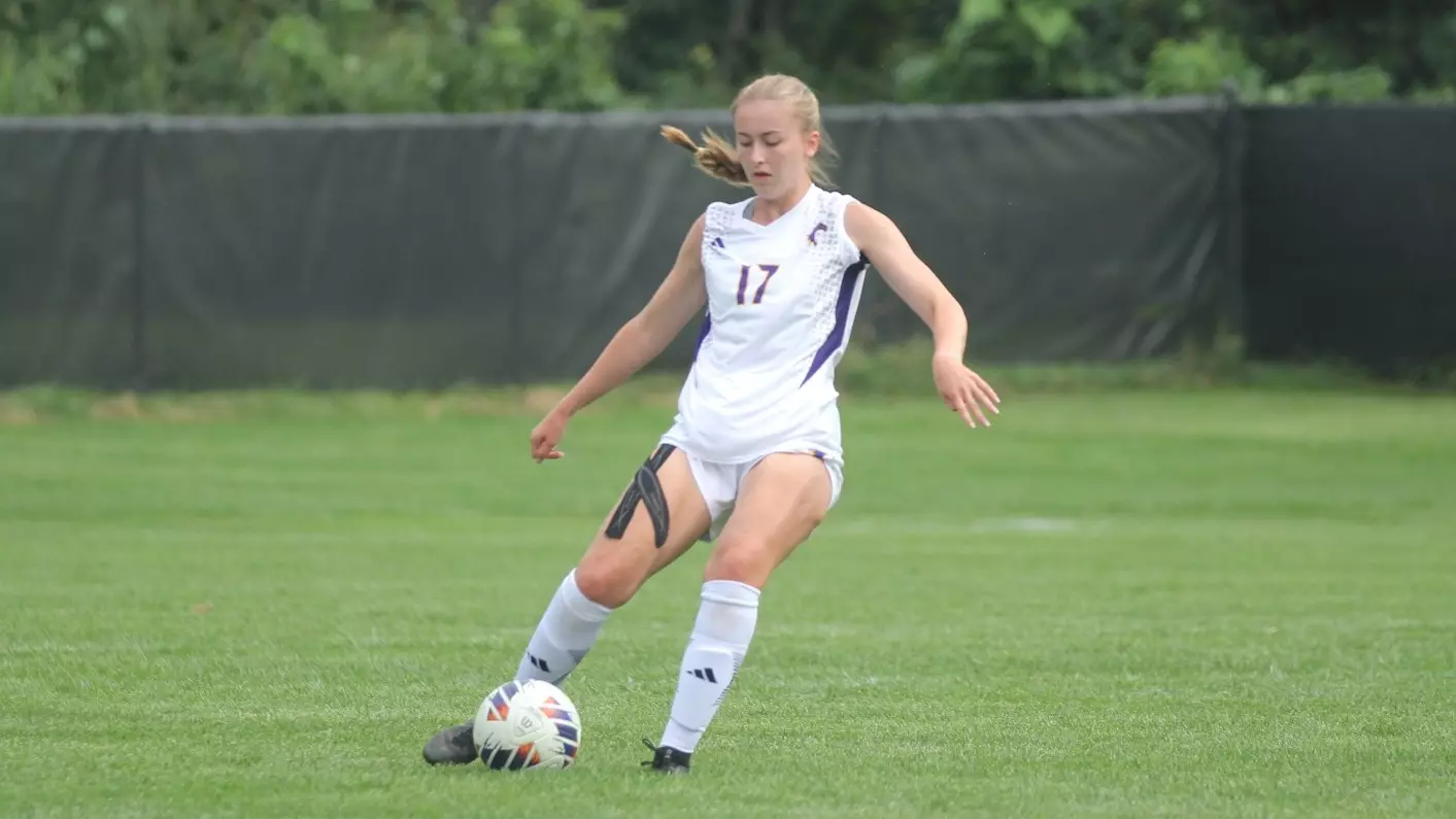 Haley Glass kicking soccer ball