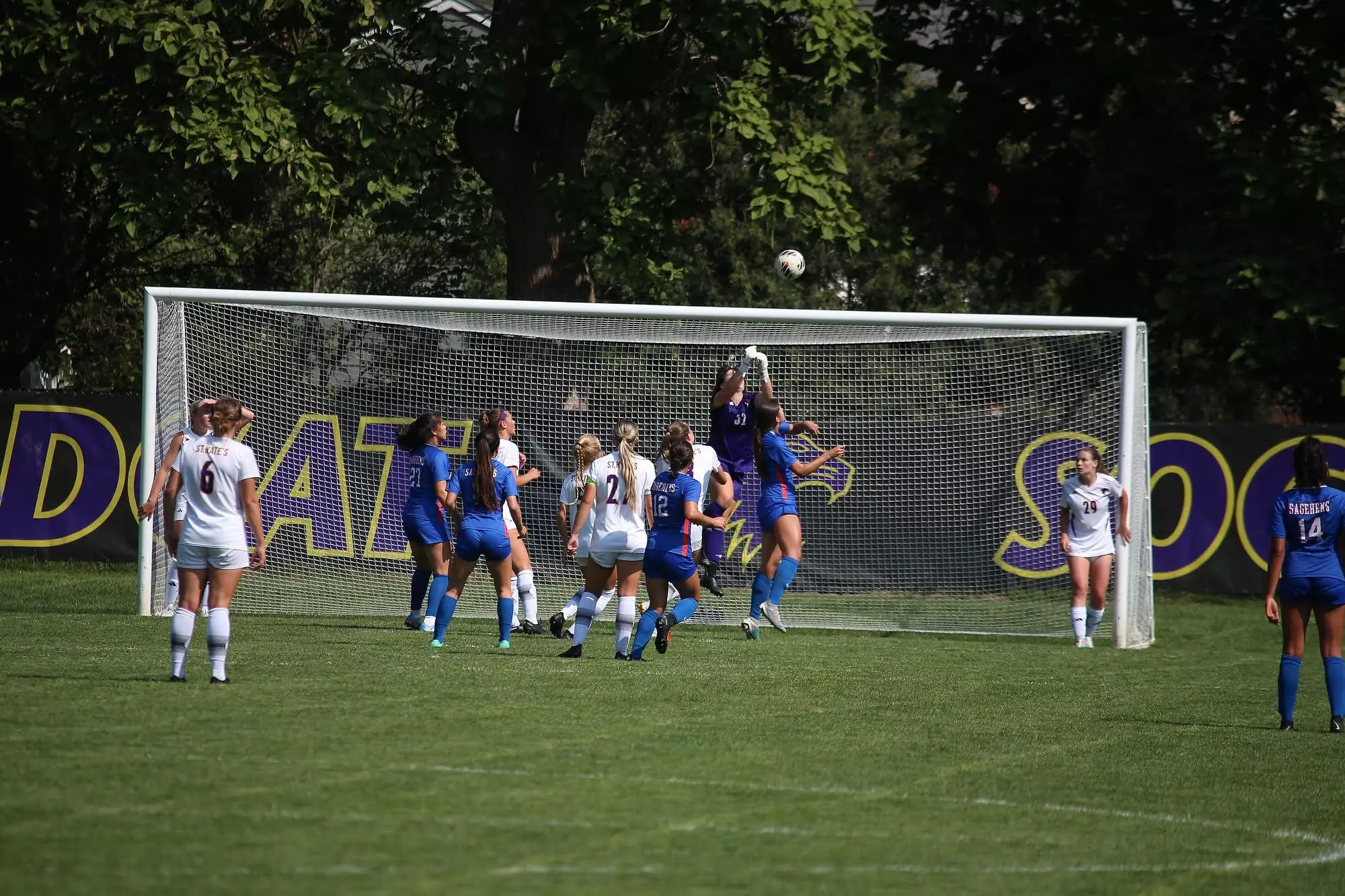 Kate Praetz saving a ball in front of the Wildcats net