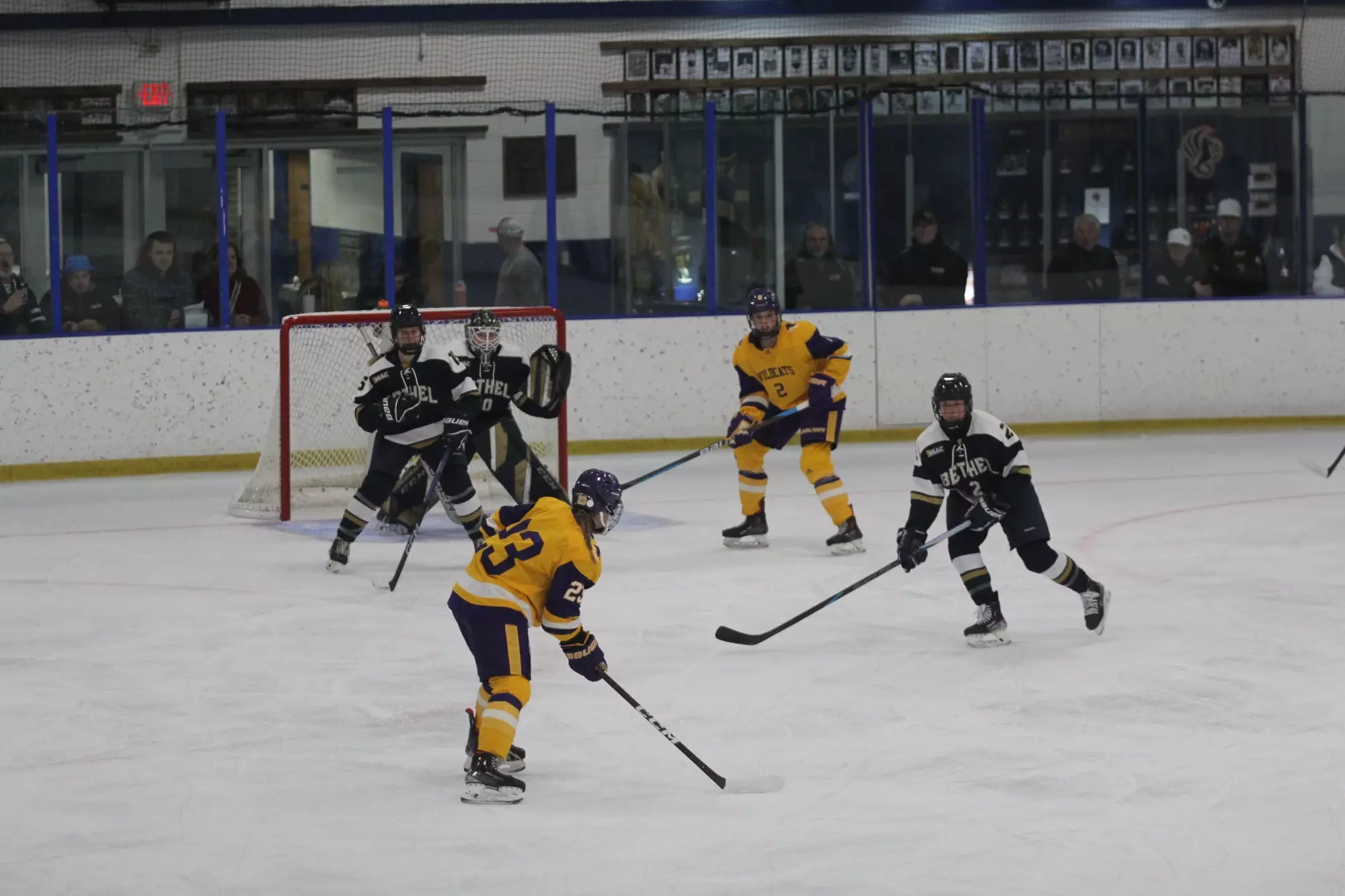 Lilly Gillespie shooting puck against Bethel