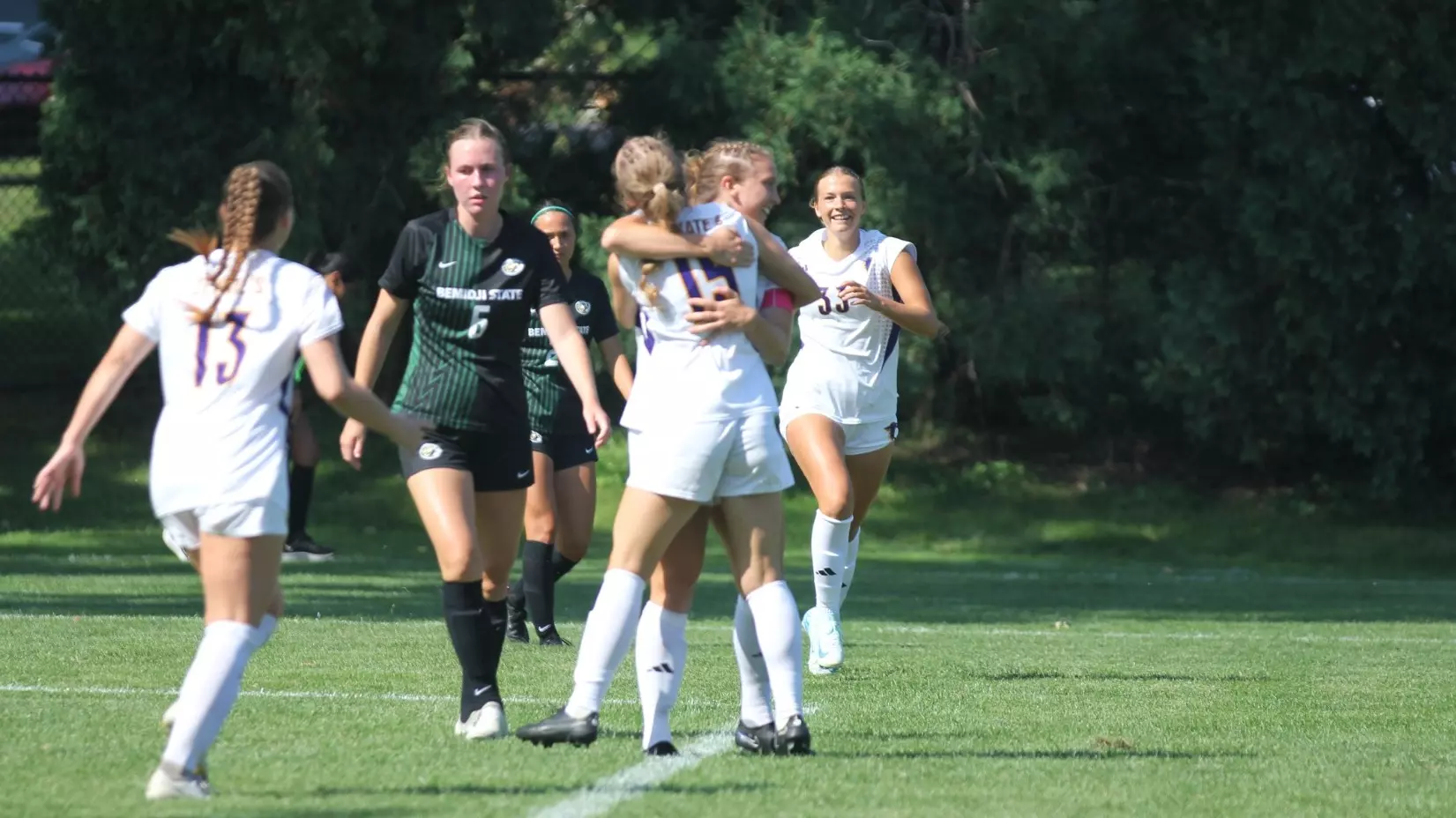 Natalie and Ari hugging after scoring