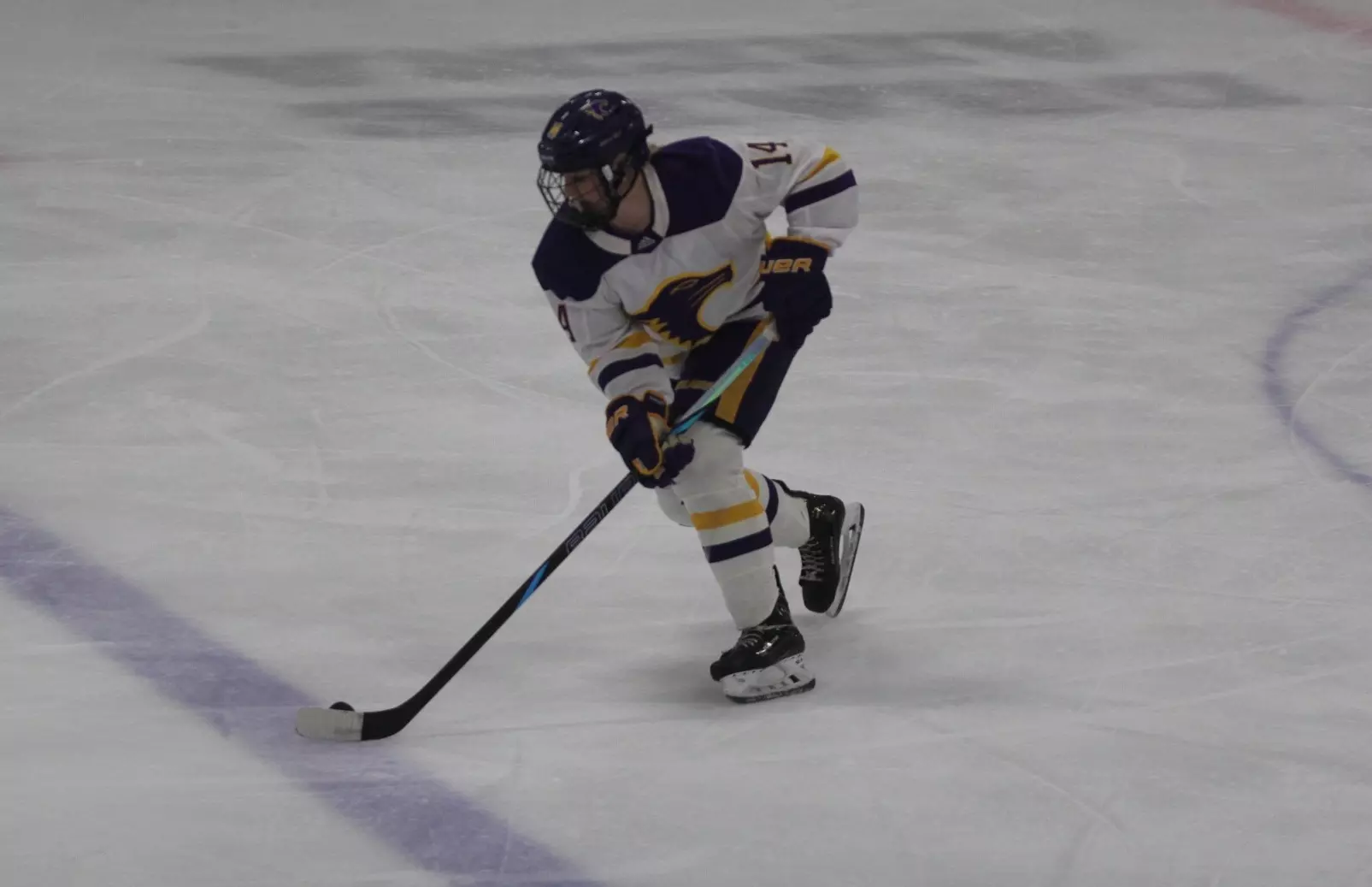 Samantha Bogen with puck crossing blue line