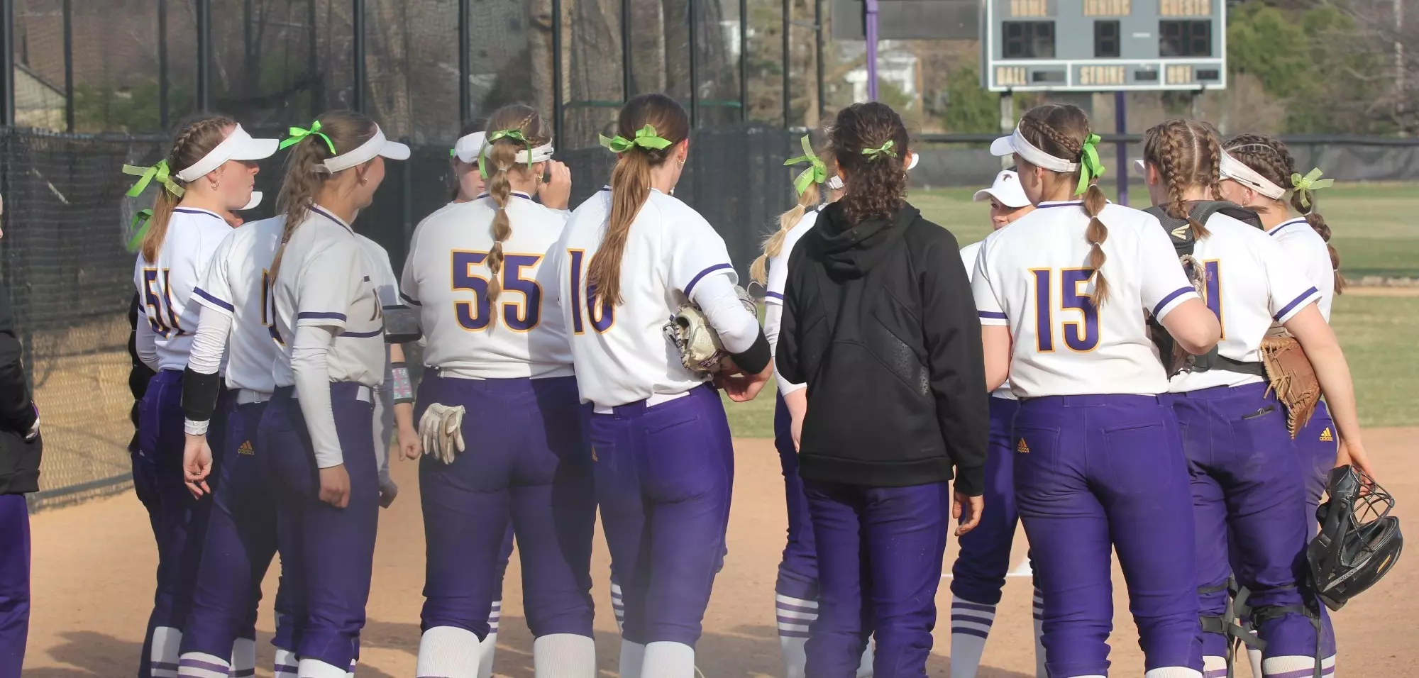 Softball team outside of dugout